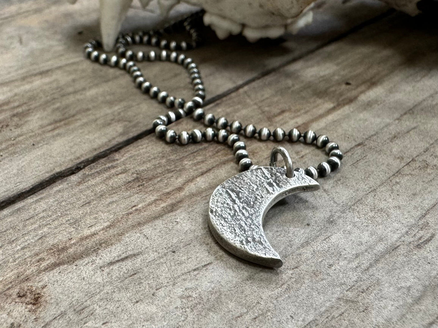 Chunky rock textured silver crescent moon necklace