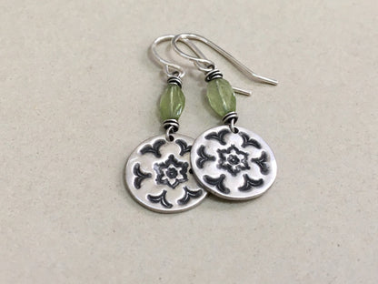 Silver stamped flower earrings with green peridot