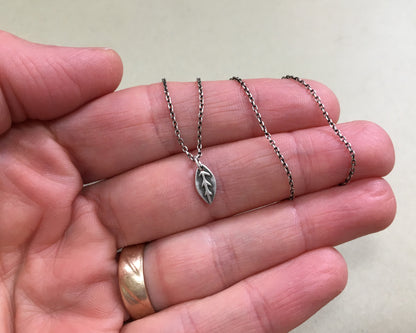 Tiny silver leaf necklace in oxidized sterling silver