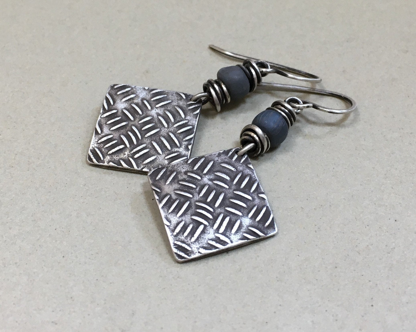 Sashiko cross stitch earrings in oxidized sterling silver with gray Java glass bead