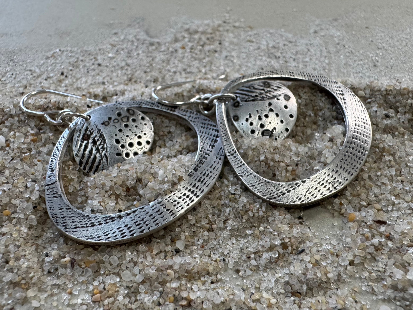 Silver seashell statement earrings with beach sand inclusions