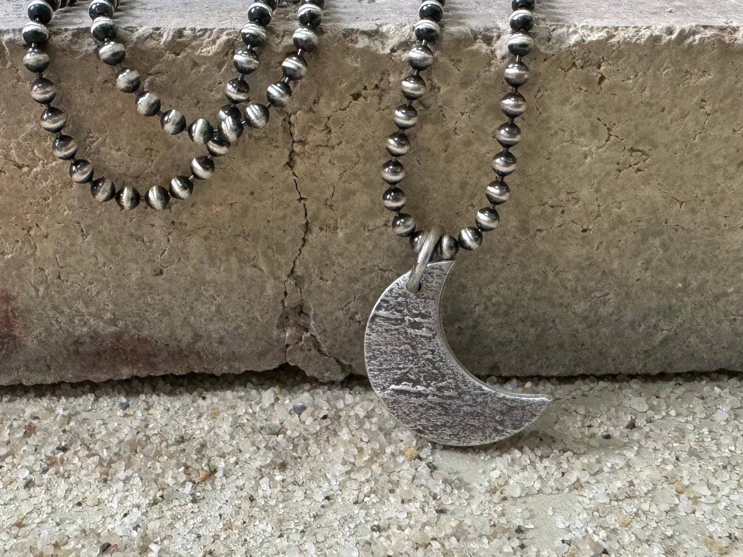 Chunky rock textured silver crescent moon necklace