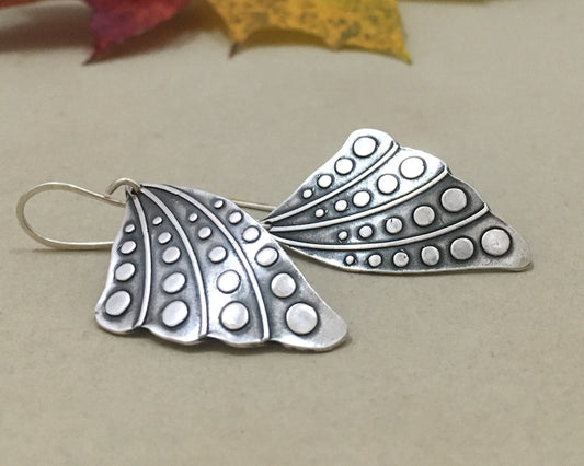 Silver butterfly wing earrings with polka dots