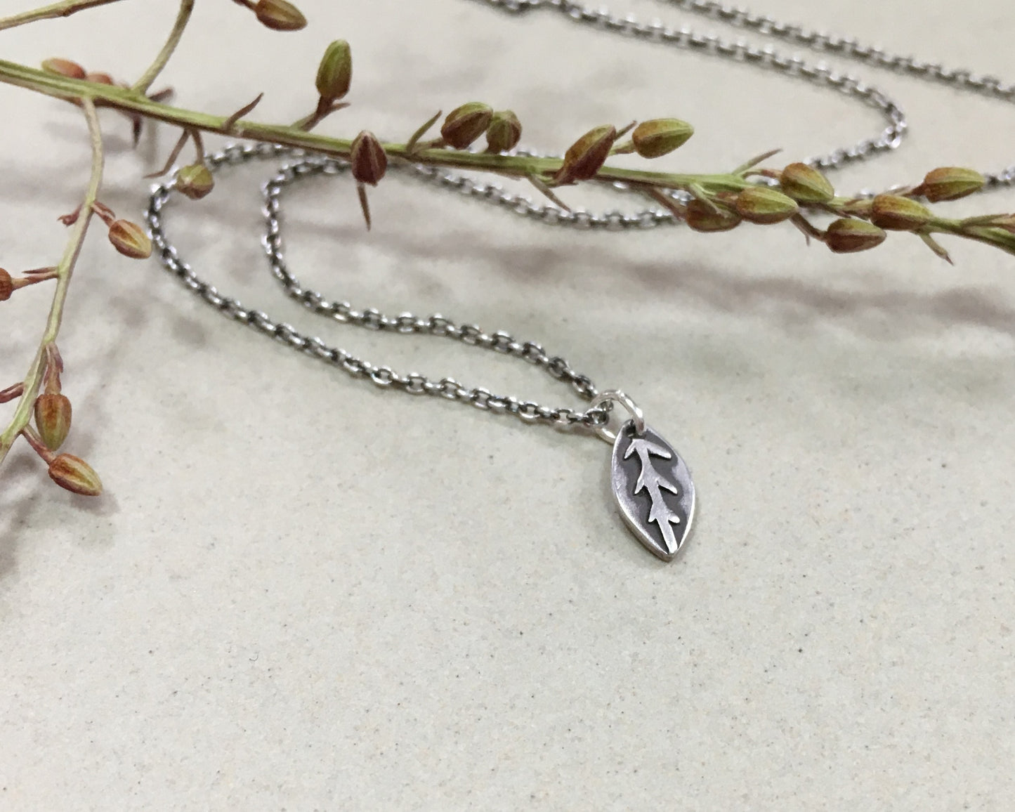 Tiny silver leaf necklace in oxidized sterling silver