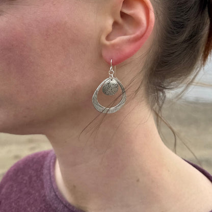 Silver seashell statement earrings with beach sand inclusions