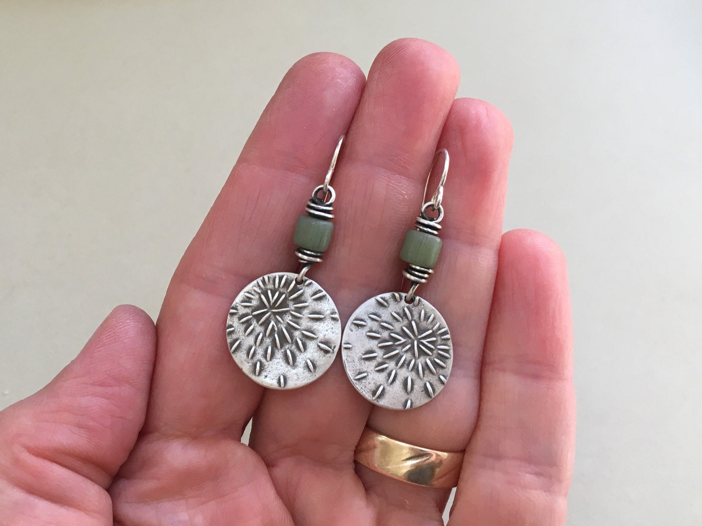 Silver starburst sashiko stitch earrings with seafoam green Java glass