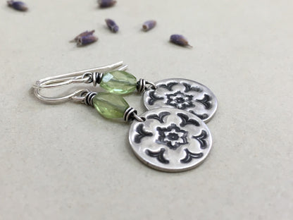 Silver stamped flower earrings with green peridot
