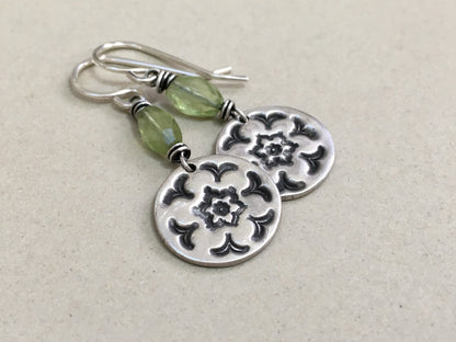 Silver stamped flower earrings with green peridot