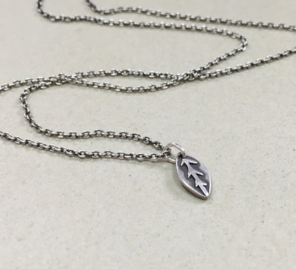 Tiny silver leaf necklace in oxidized sterling silver