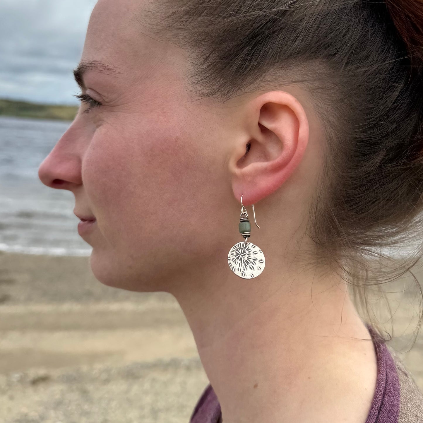 Silver starburst sashiko stitch earrings with seafoam green Java glass
