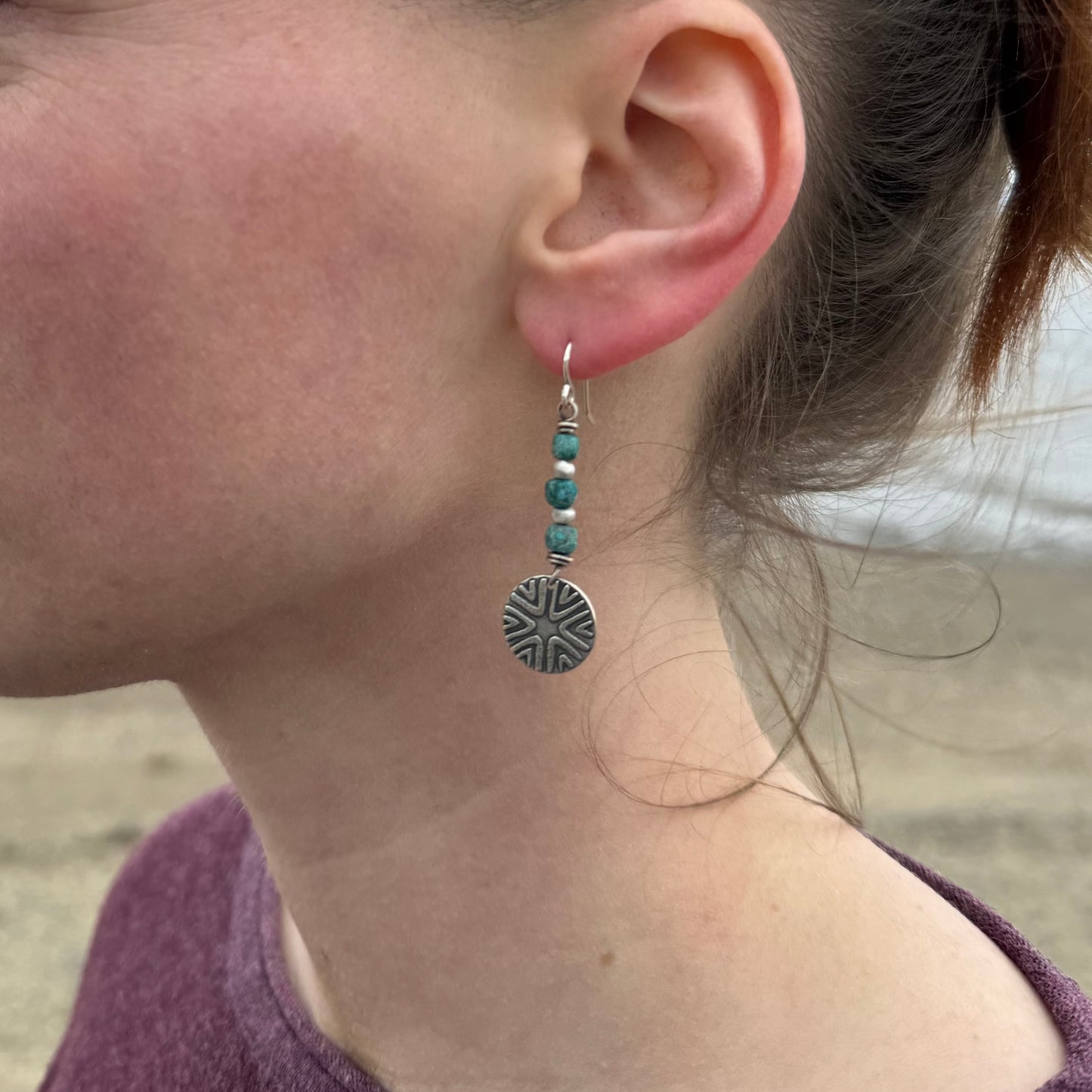 Tribal-style geometric design with turquoise bead stack