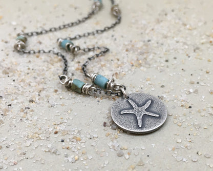 Silver starfish necklace on beaded chain