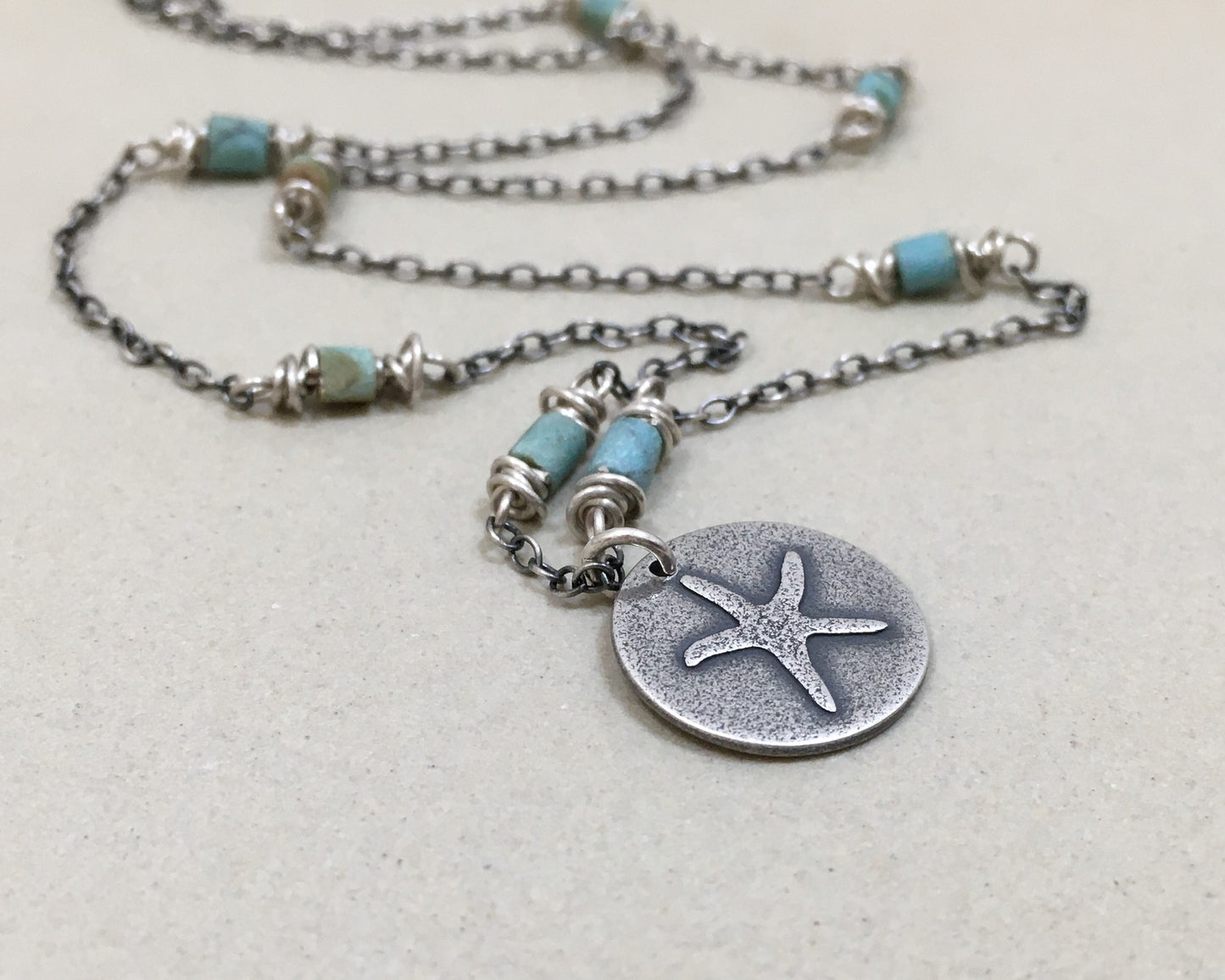 Silver starfish necklace on beaded chain