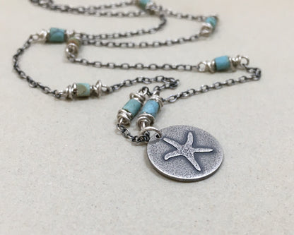 Silver starfish necklace on beaded chain