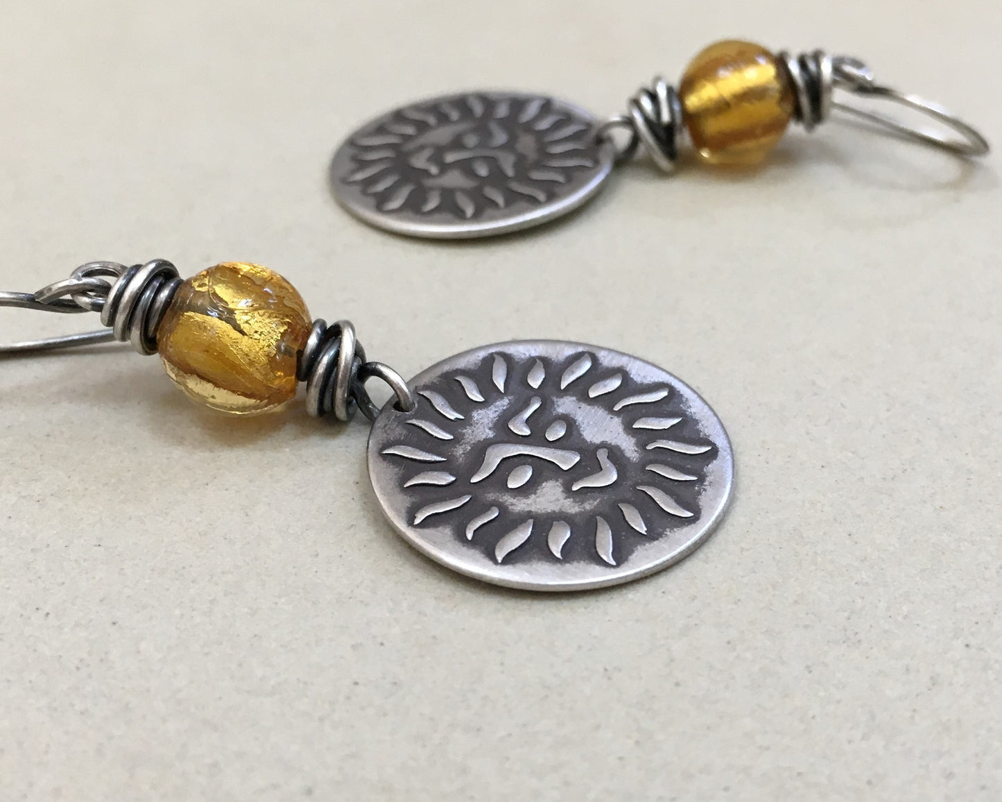 Happy sun face in oxidized sterling silver with gold foil bead