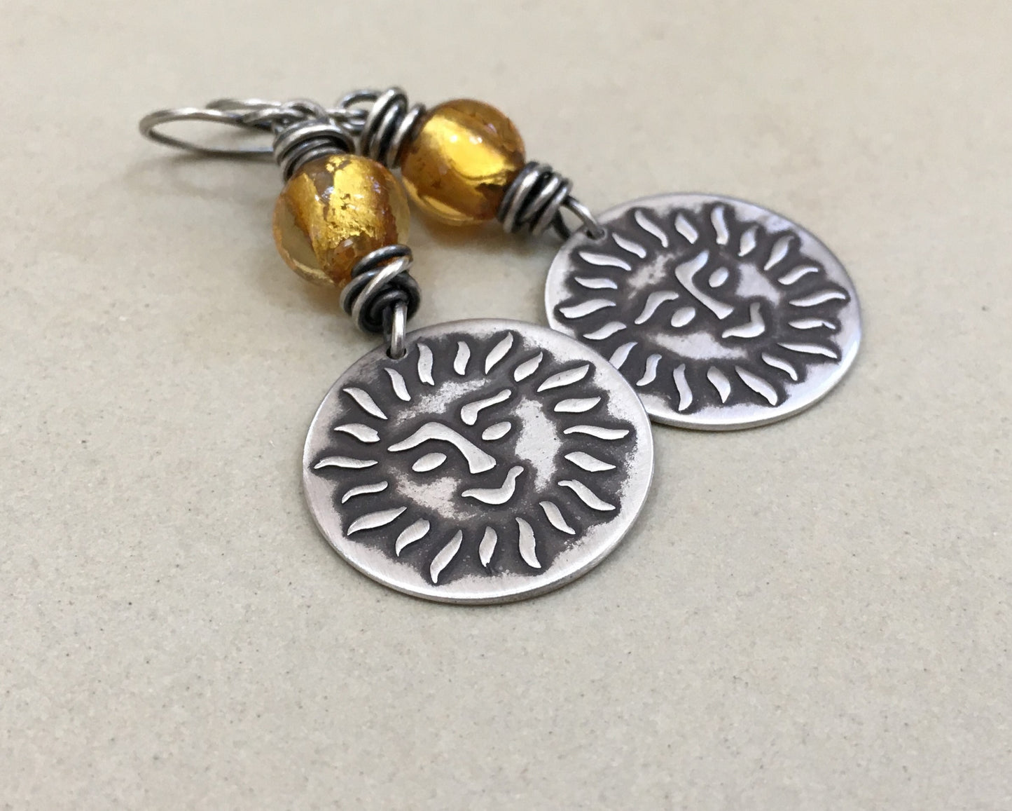 Happy sun face in oxidized sterling silver with gold foil bead