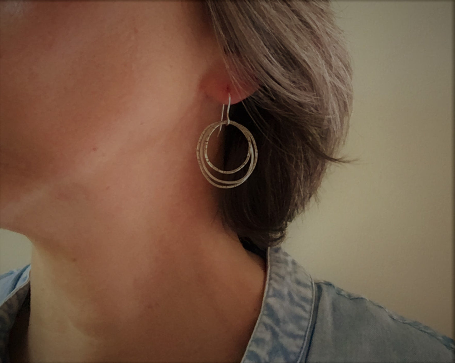 Multiple textured hoop earrings in oxidized sterling silver