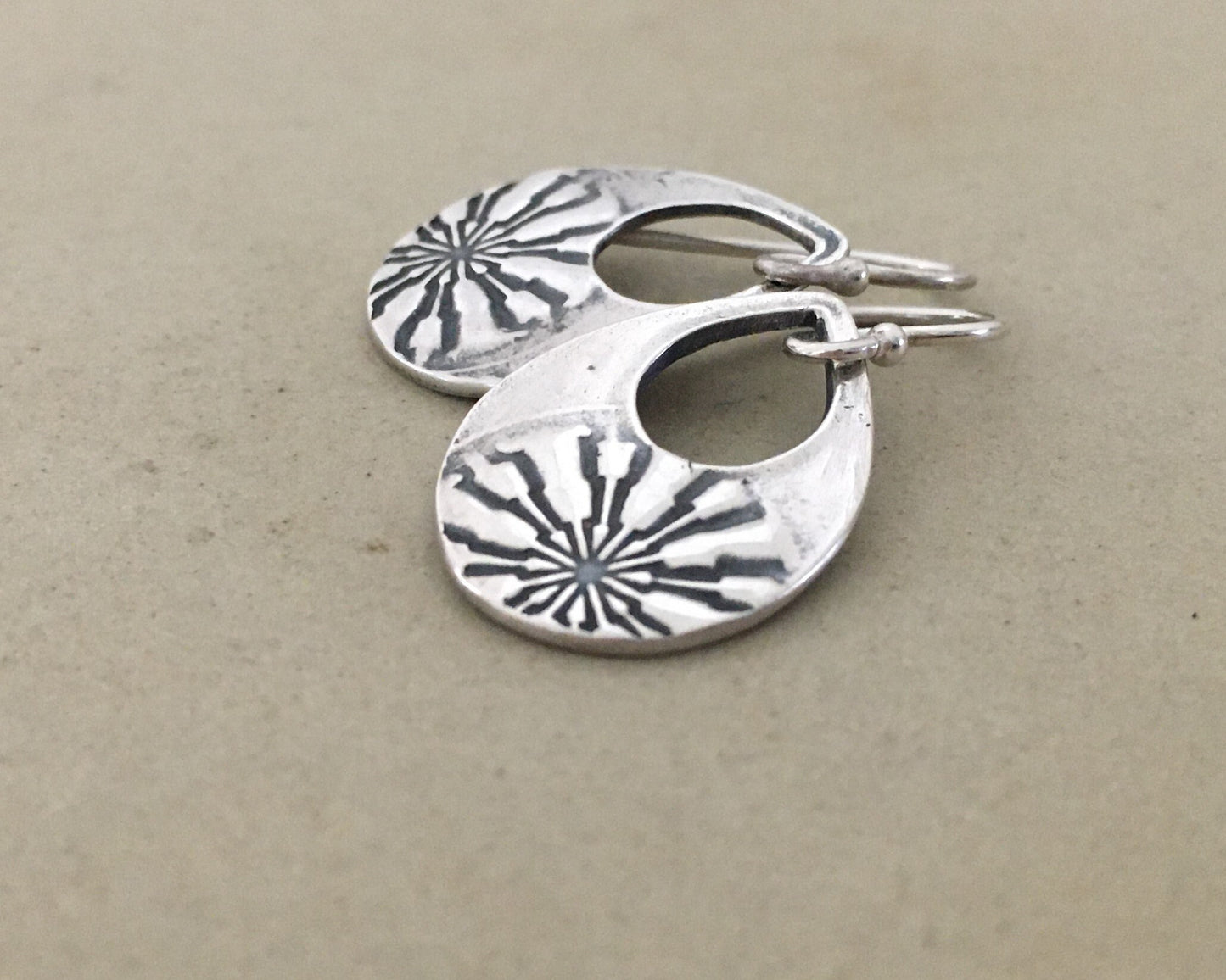 Silver mandala teardrop earrings from vintage button