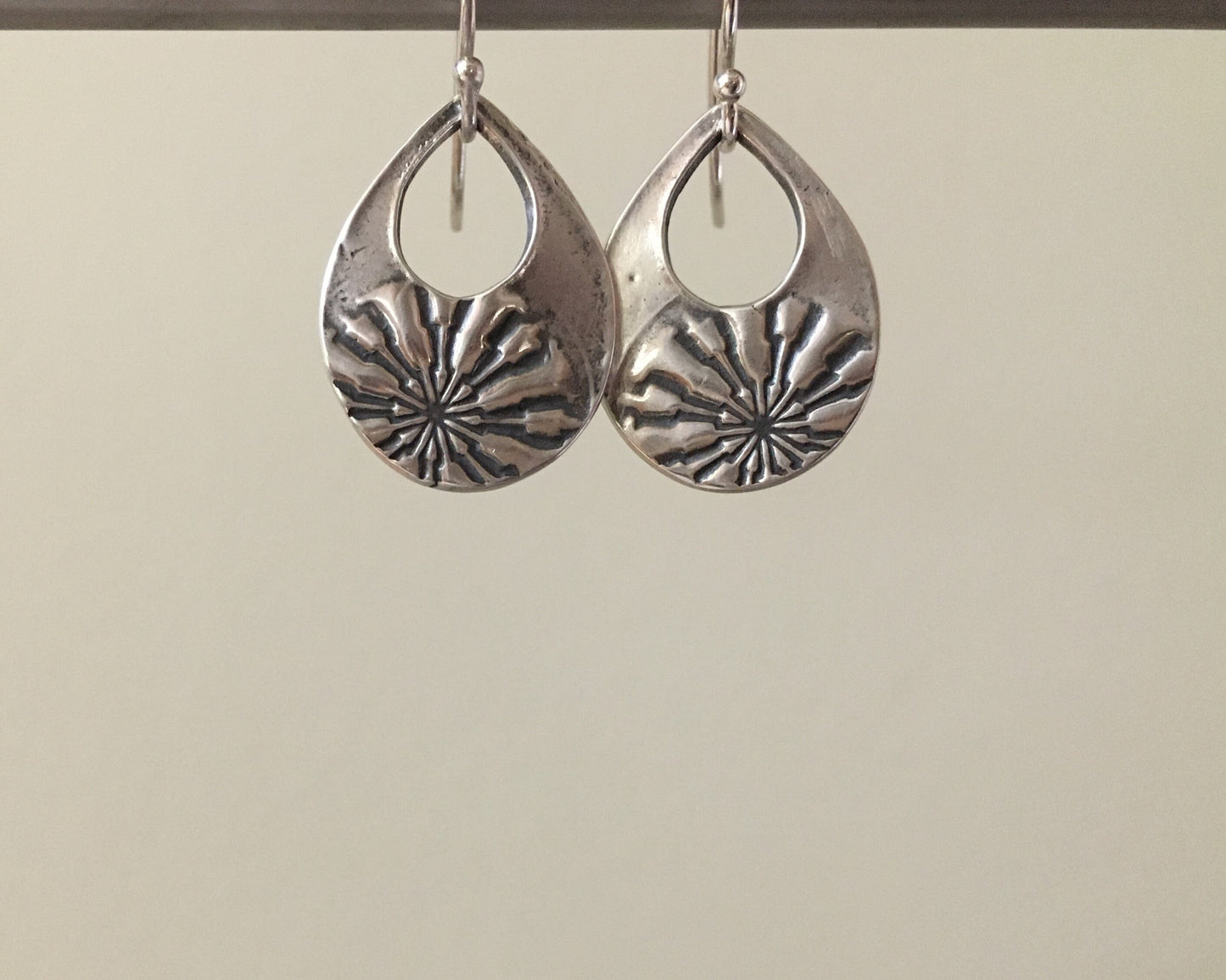 Silver mandala teardrop earrings from vintage button