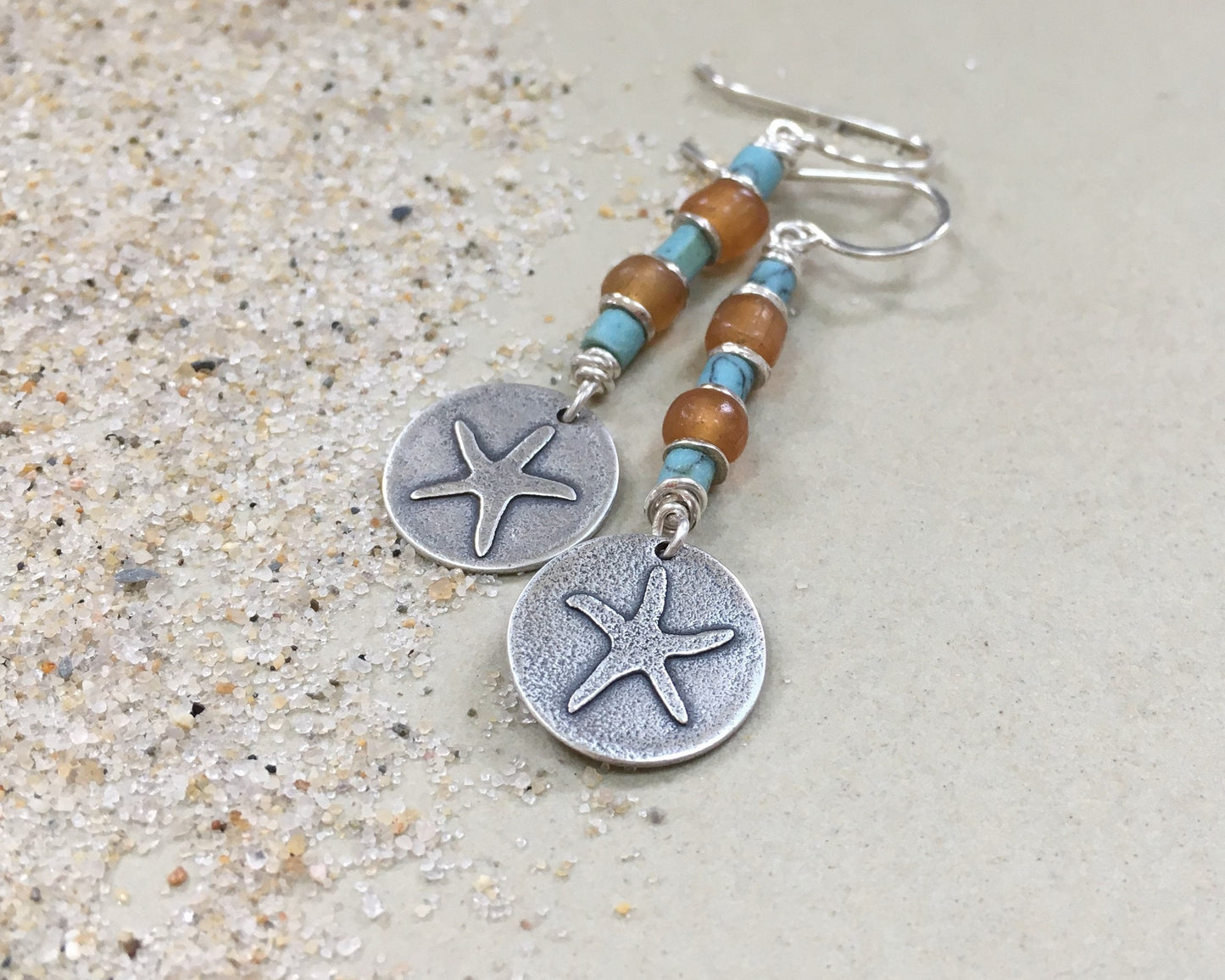 Silver starfish earrings with blue & yellow bead stack