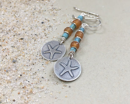 Silver starfish earrings with blue & yellow bead stack