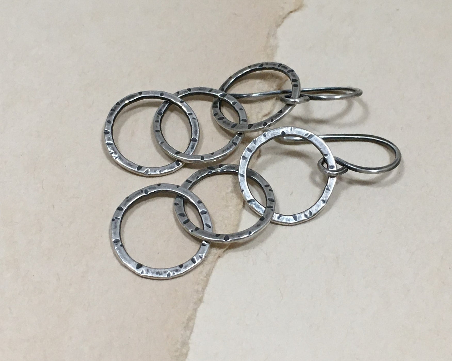 Triple linked textured hoops in oxidized sterling silver