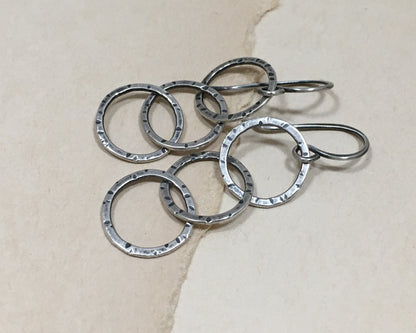 Triple linked textured hoops in oxidized sterling silver