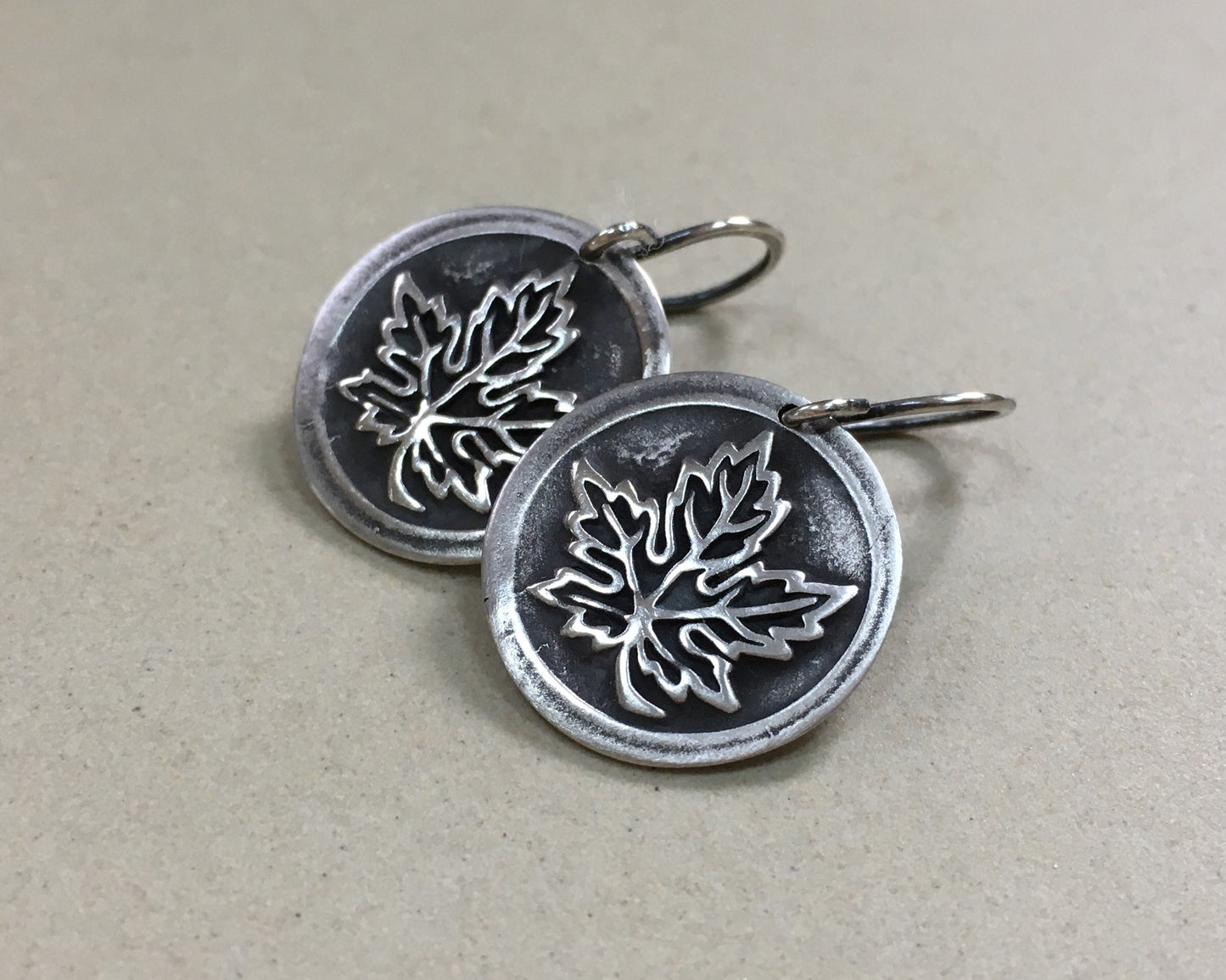 Maple leaf earrings in oxidized sterling silver - cast from vintage button