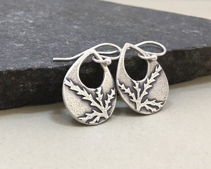 Botanical evergreen design on silver teardrop earrings
