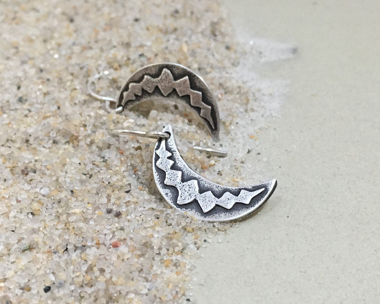 Silver crescent moon earrings with simple rustic design