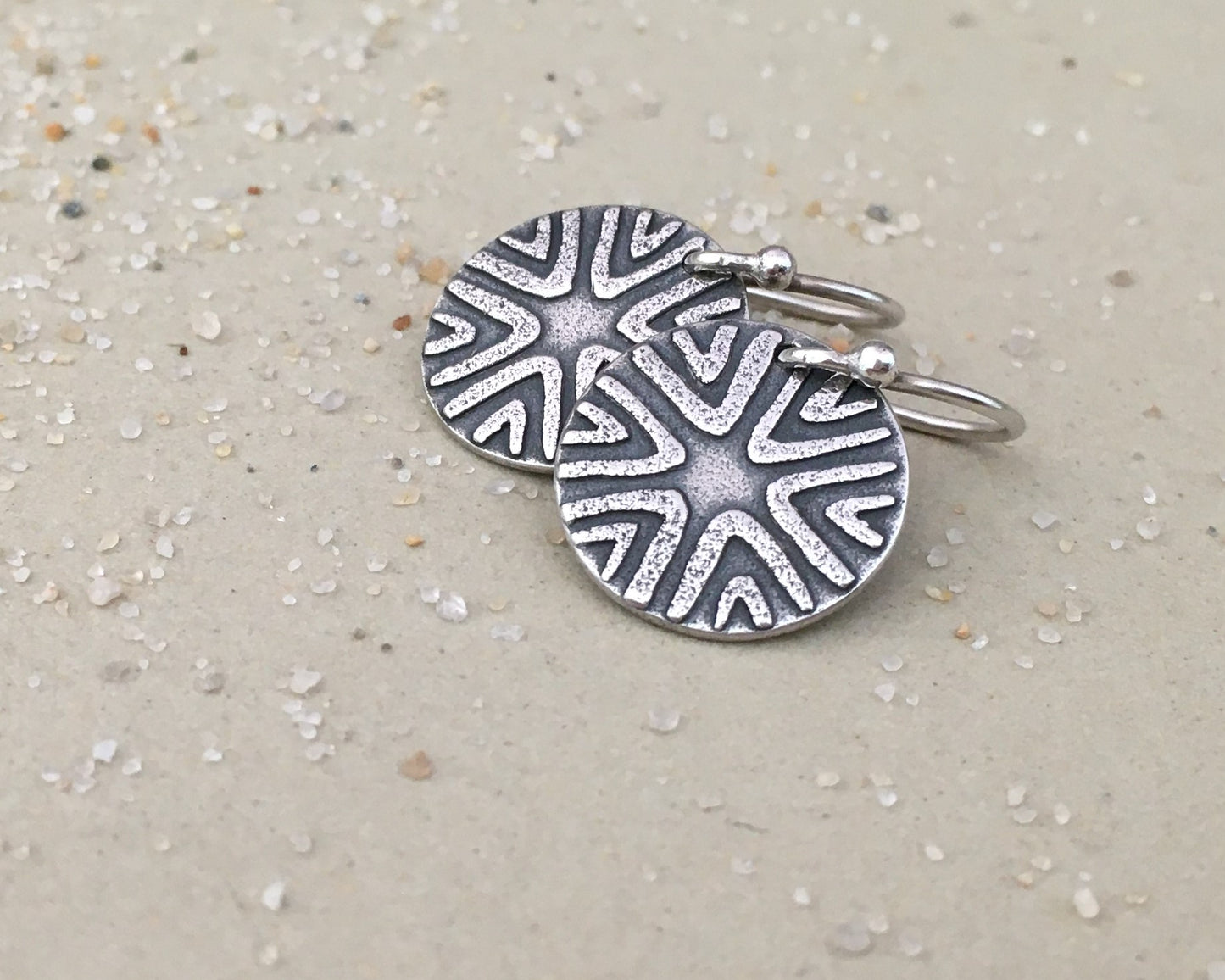 Primitive geometric discs in oxidized sterling silver