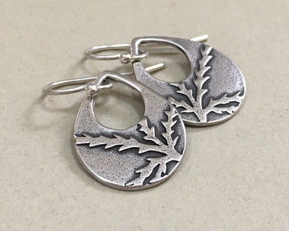 Botanical evergreen design on silver teardrop earrings