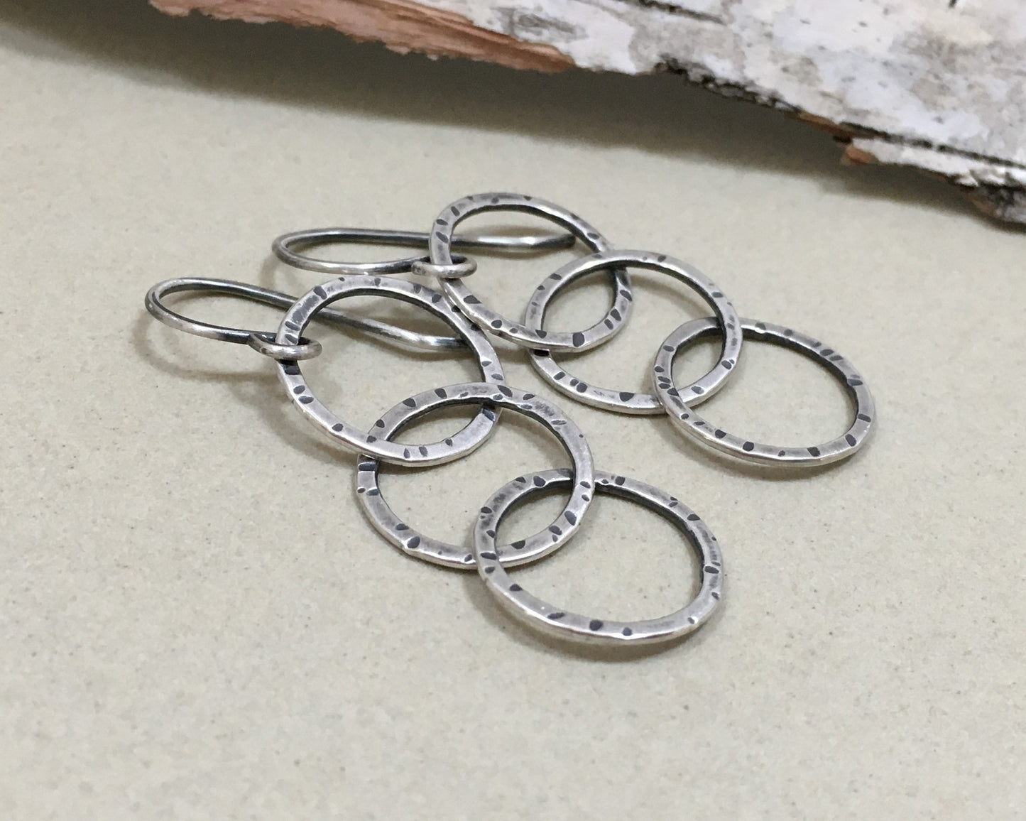 Triple linked textured hoops in oxidized sterling silver