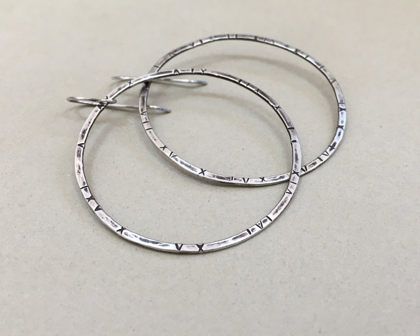Large textured hoops in oxidized sterling silver