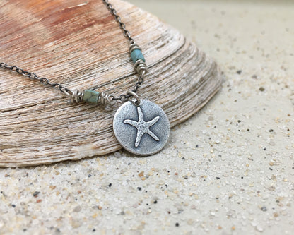 Silver starfish necklace on beaded chain