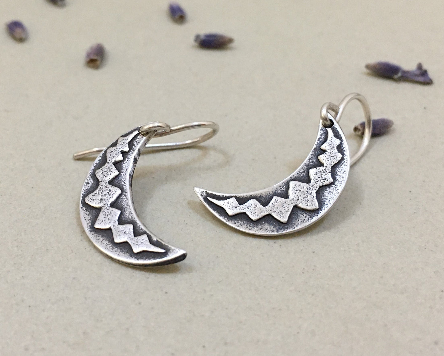 Silver crescent moon earrings with simple rustic design