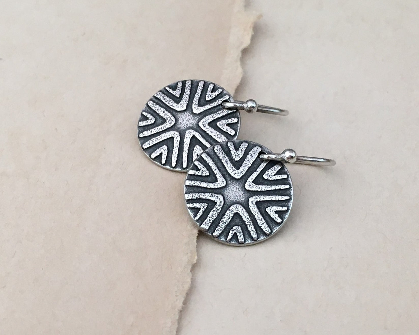 Primitive geometric discs in oxidized sterling silver