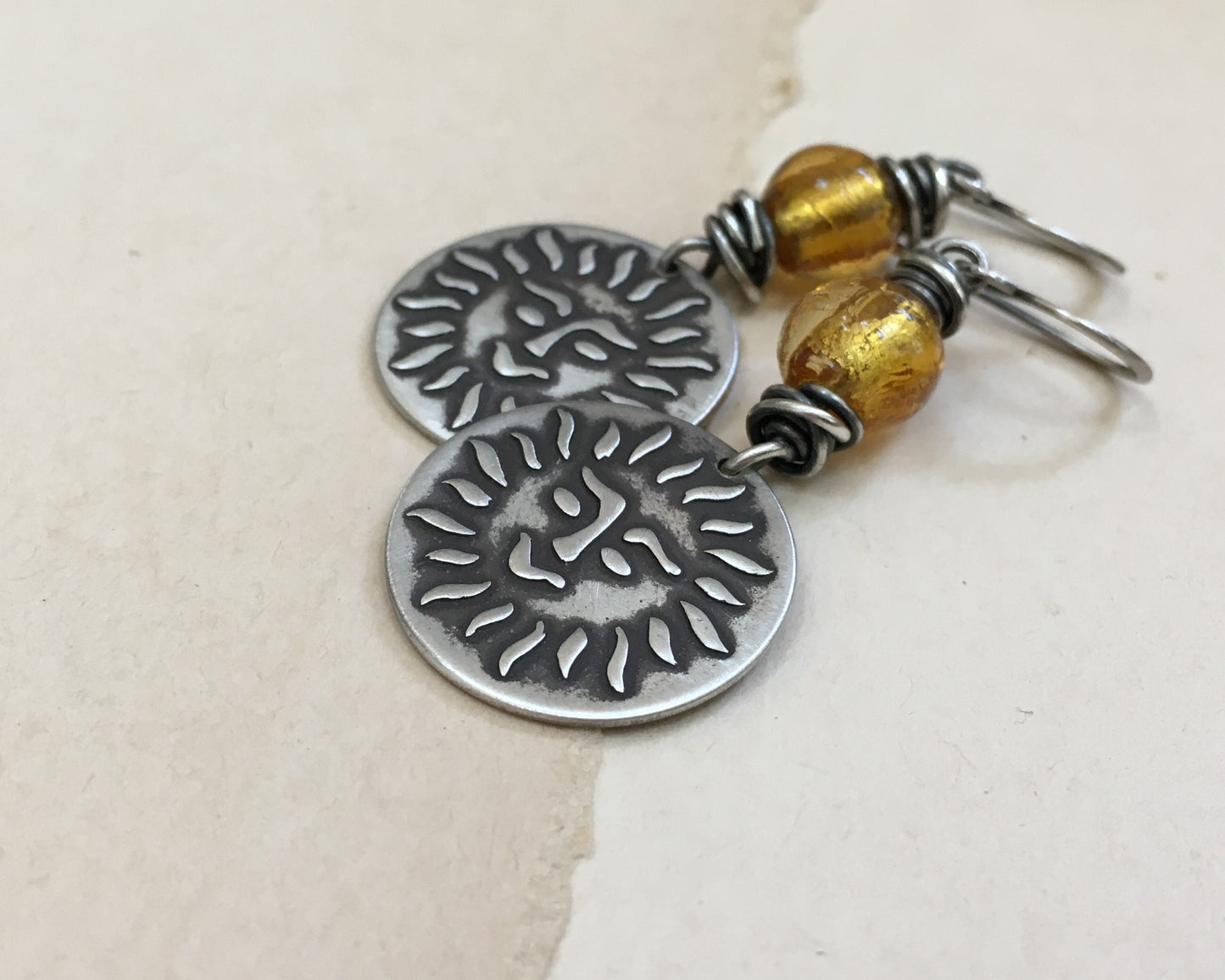 Happy sun face in oxidized sterling silver with gold foil bead
