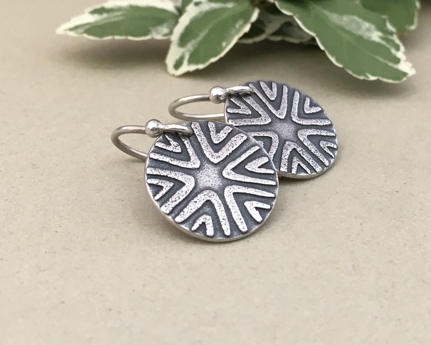 Primitive geometric discs in oxidized sterling silver