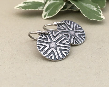 Primitive geometric discs in oxidized sterling silver