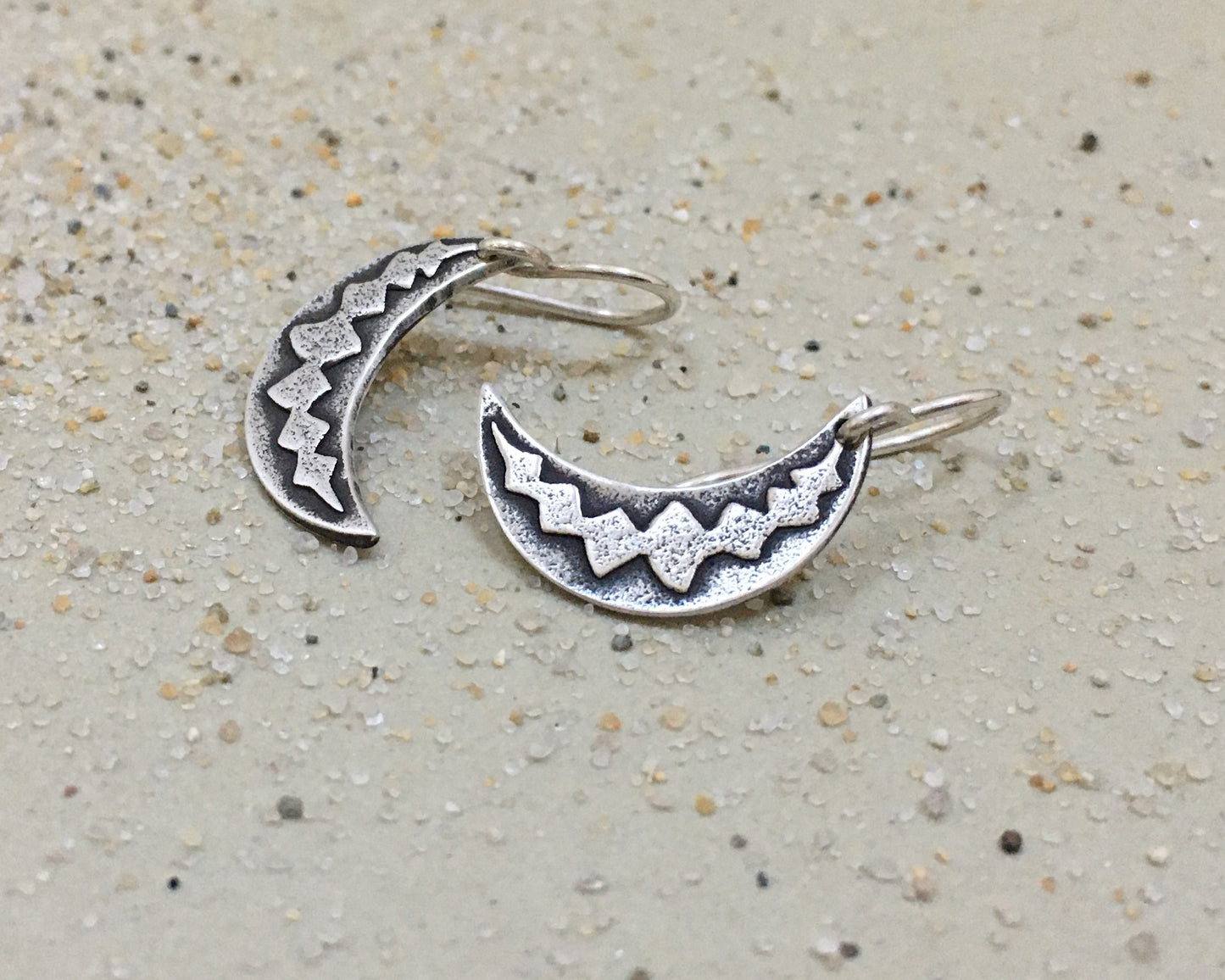 Silver crescent moon earrings with simple rustic design
