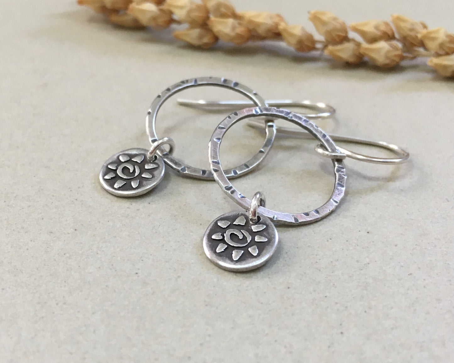 Small hoops with primitive sun dangles in oxidized sterling silver
