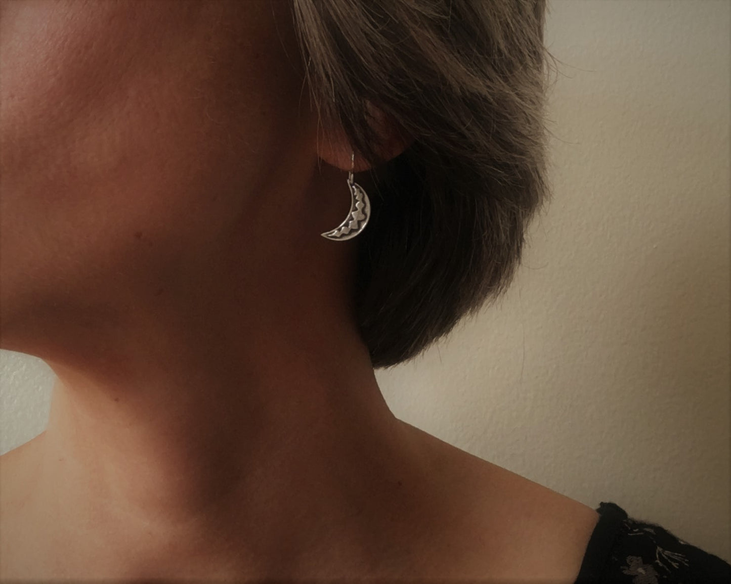 Silver crescent moon earrings with simple rustic design