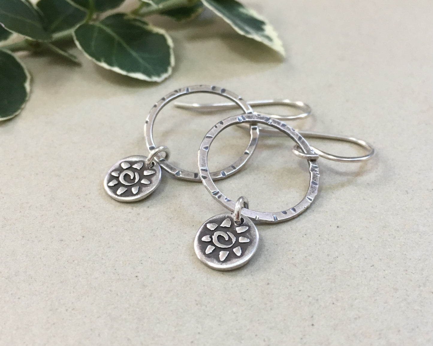 Small hoops with primitive sun dangles in oxidized sterling silver