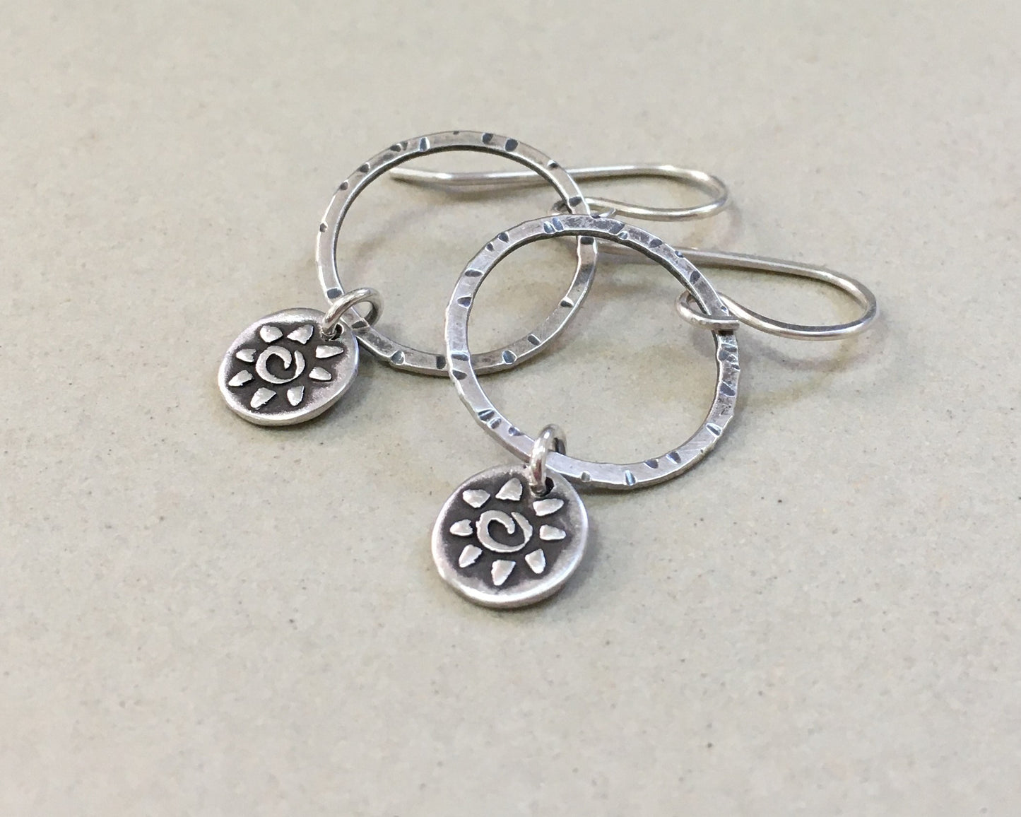 Small hoops with primitive sun dangles in oxidized sterling silver