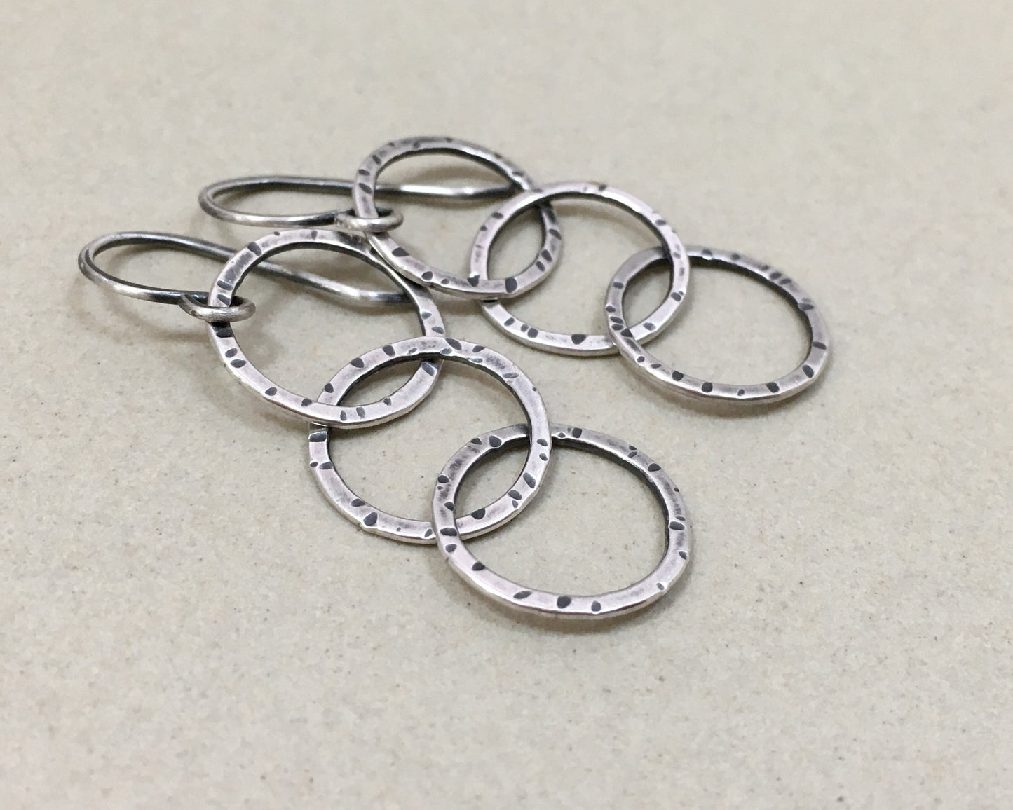 Triple linked textured hoops in oxidized sterling silver