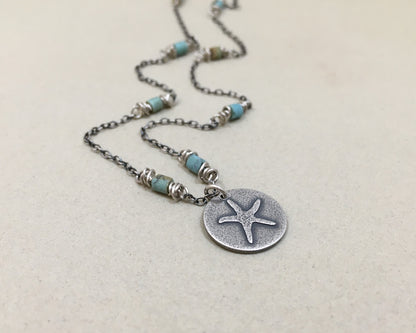 Silver starfish necklace on beaded chain