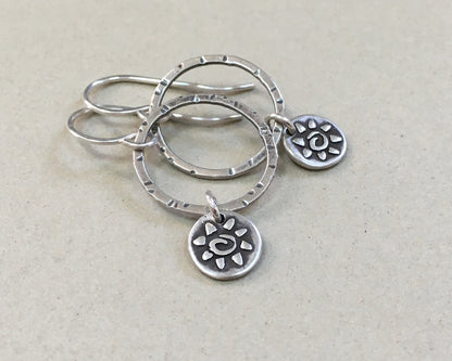 Small hoops with primitive sun dangles in oxidized sterling silver