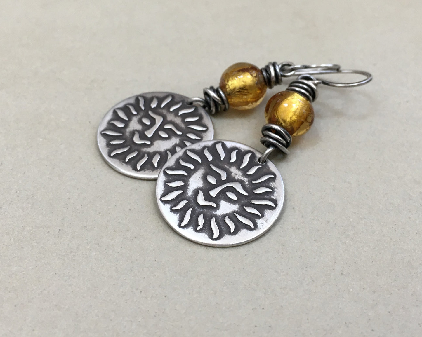 Happy sun face in oxidized sterling silver with gold foil bead