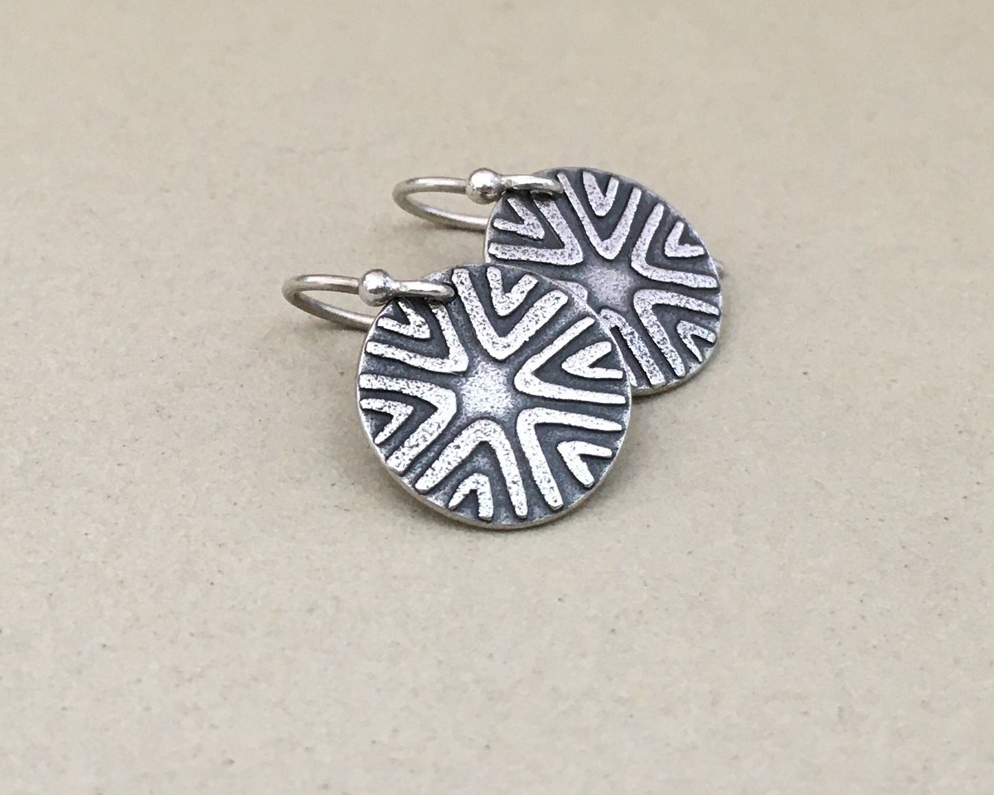 Primitive geometric discs in oxidized sterling silver